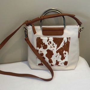 Altered state cow print and leather bag
